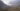 Starting to come out from the clouds on the way down. There were many switchbacks and I had to keep stopping to warm my hands from the cold mist which seemed to penetrate my gloves. The first village to appear in the distance was Huanacota.